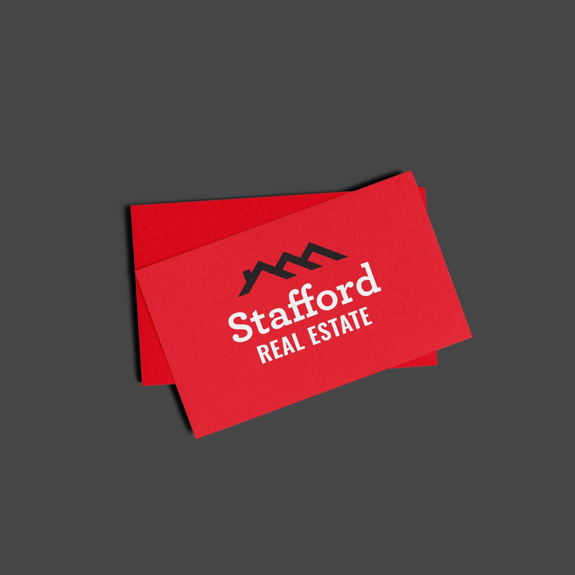 red business card with Stafford Real Estate logo